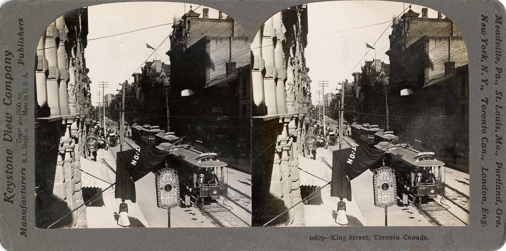 Stereoscopic photograph card of the view looking west along King Street from the Grand Opera Ho…