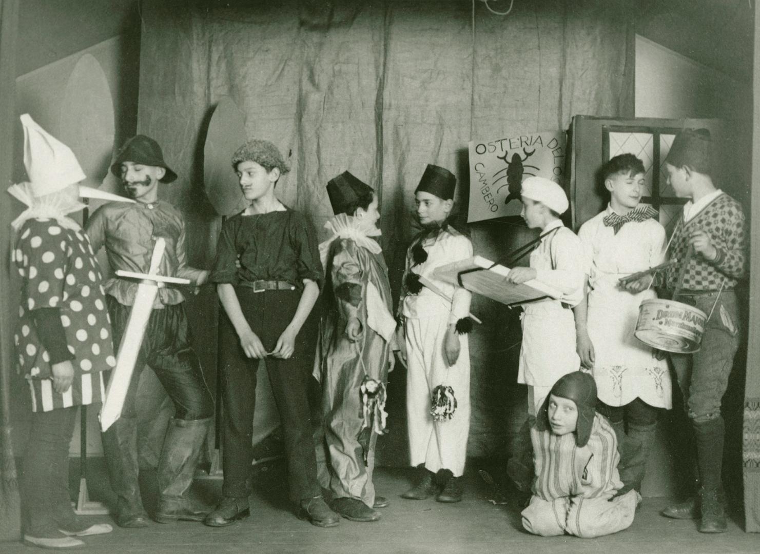 Group of children dressed in costumes for a play.