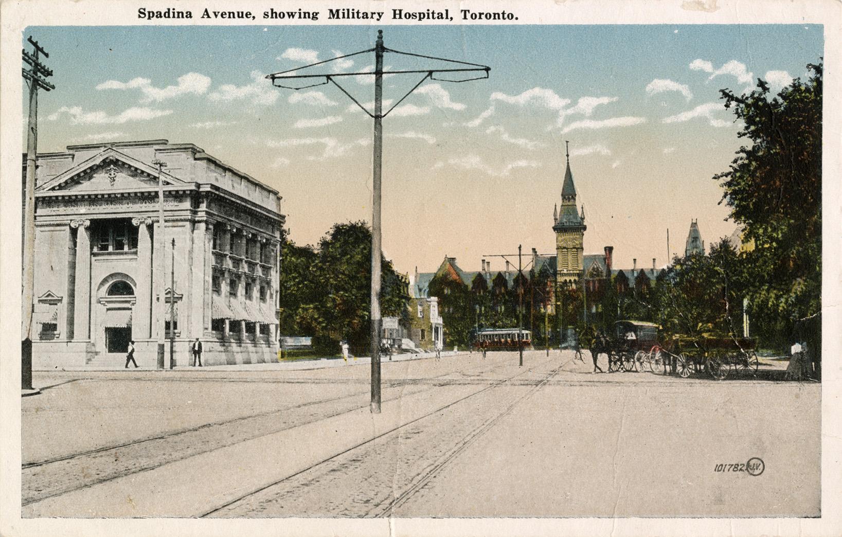 Colorized photograph of a large gothic building at the top of a city street.
