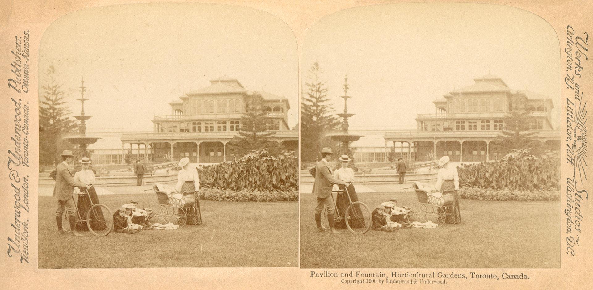 Pictures show people wandering in a large formal garden with a fountain and Victorian house in …