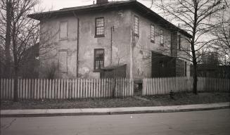 Rusholme is a large house, with a central door, three dormer windows in the roof, multi-section…