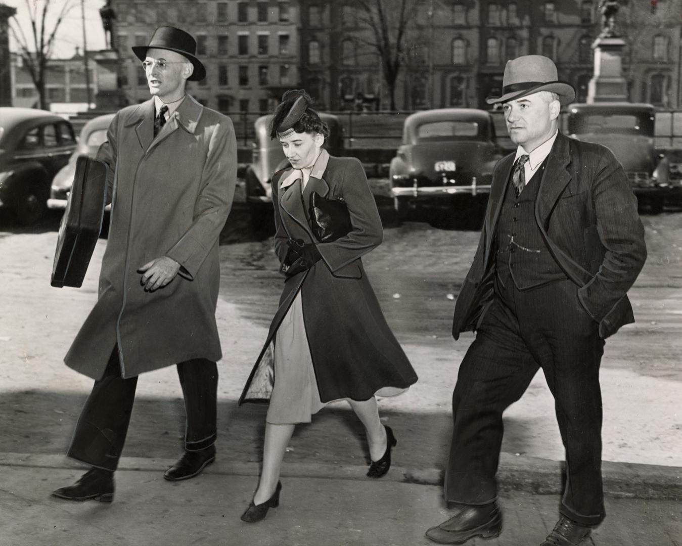 All dressed up in her Easter best, Mrs. Emma Woikin, one of seven charged with complicity in espionage activities, is shown after ottawa court appeara(...)