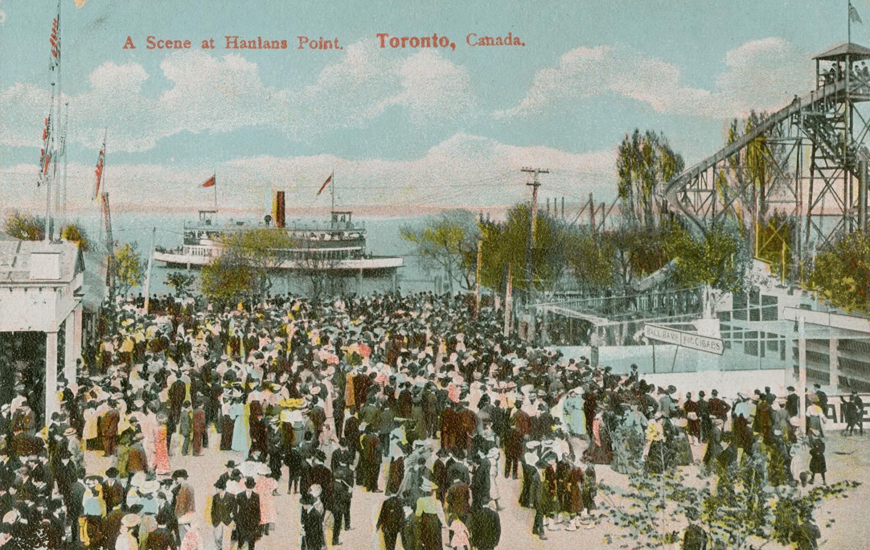 Picture of a large crowd of people at an amusement park with roller coaster and a ferry in the …