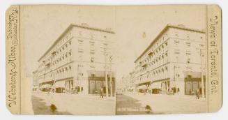 Pictures show the corner of a five story commercial building