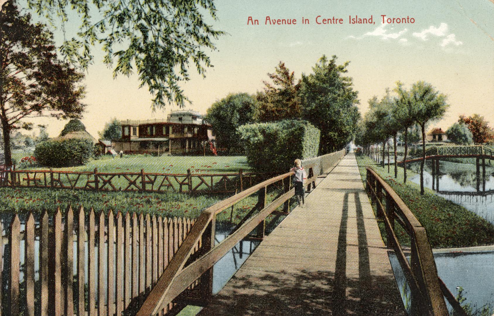 Picture of a child standing on a bridge with other bridges and buildings in the background. 