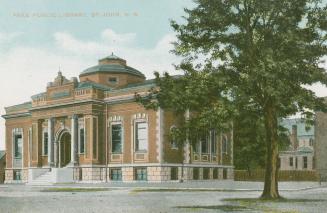 Picture of large public library with front pillars and dome on the roof and large tree to the r…