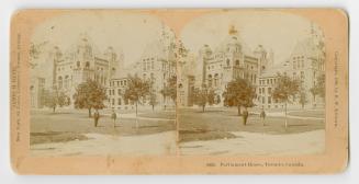 Pictures show two people standing on the lawn in from of a huge Ricardsonian Romanesque buildin…