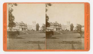 Pictures show a three story Second Empire building with a large church behind it. Large expanse…