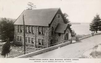 Black and white picture of stone, country church.