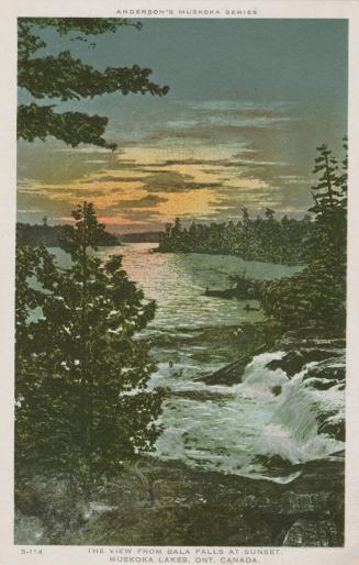 A sailboat on a large lake in the wilderness.