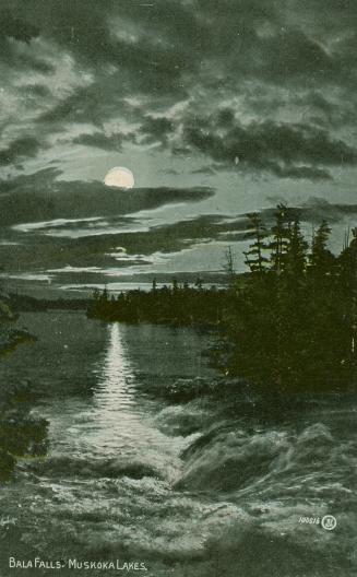 A full moon over a lake and waterfalls.