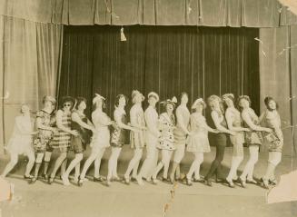 Black and white photograph of the cast of "Biff! Bing! Bang!" posing onstage at the Ambassador …