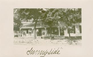 Picture of a cottage with large porch. 