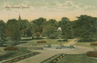 High angle shot of large urban gardens with a fountain in the middle.