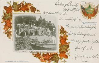 Black and white picture of a large group of people on the balcony of structure on a sandy shore…