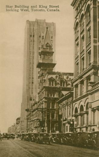  Art Deco sky scrapers line a city street. Sepia toned.