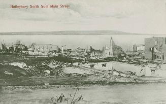 Black and white picture of town buildings in ruins after a devastating fire.