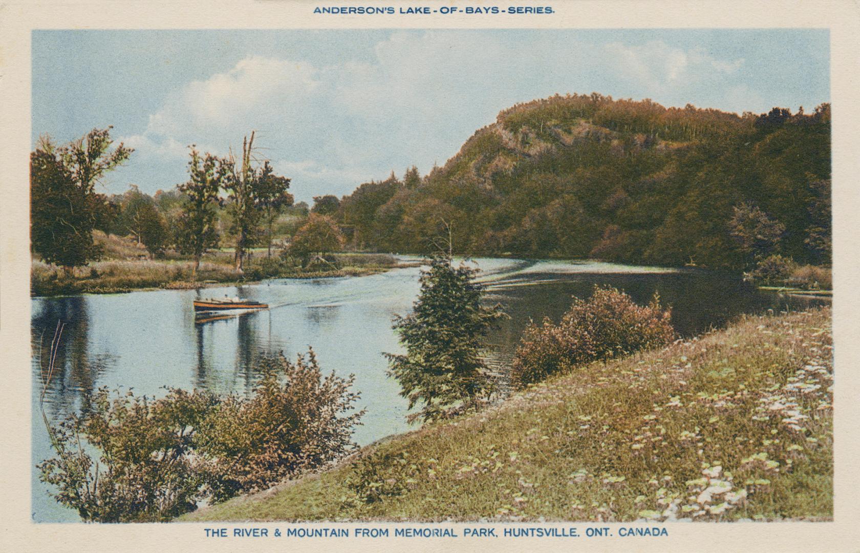 A motor boat on a river in the wilderness.