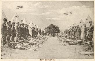 Sepia toned picture of a group of airmen lined up in front of tents in a military camp.