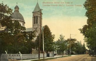 Large corner church with tower and dome. 