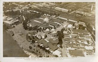 Aerial shot of large of large buildings in exhibition grounds. B & W.