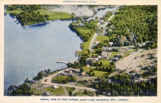 Aerial shot of a lake and wilderness in cottage country.