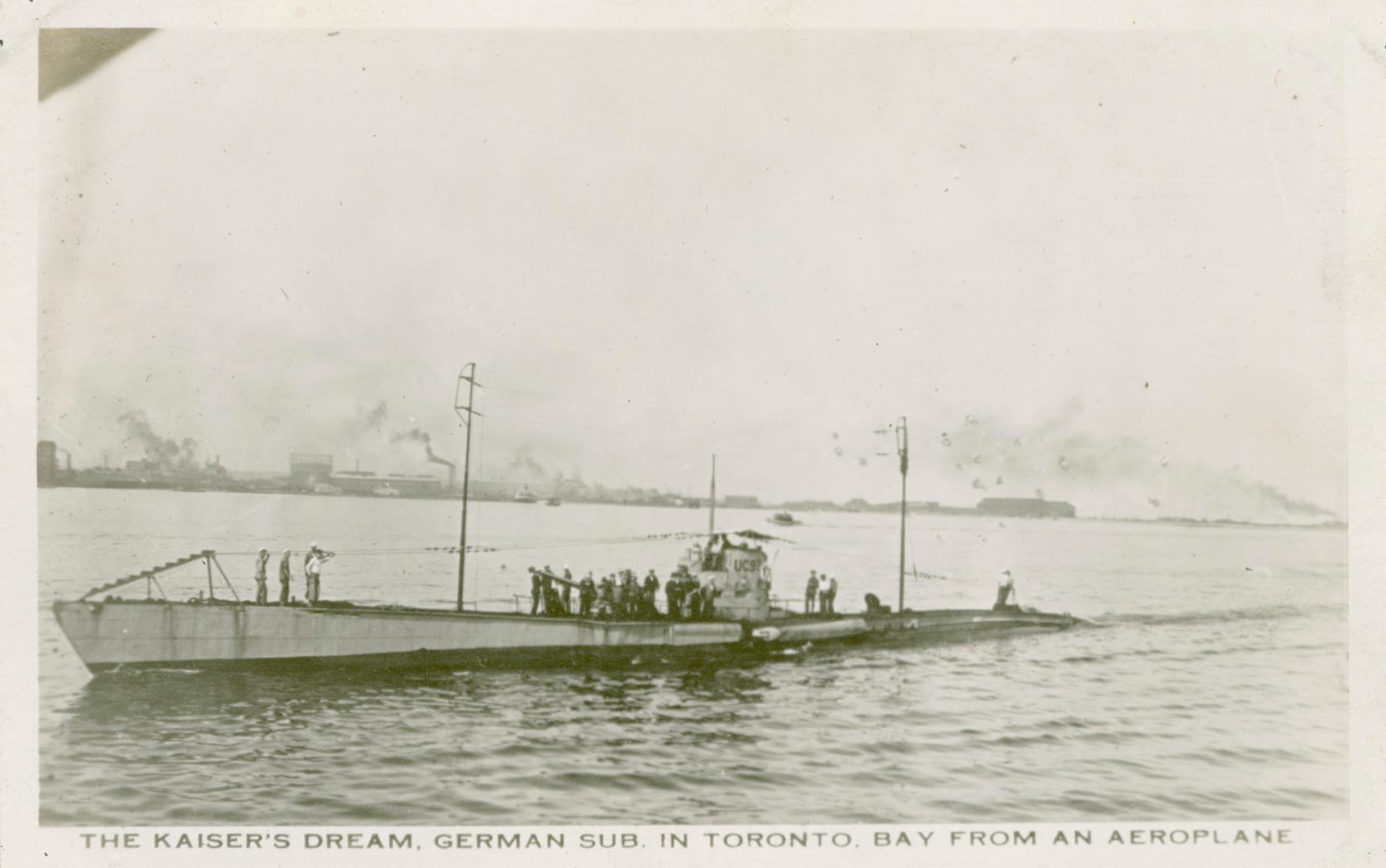 Black and white photograph of a submarine emerging from a body of water.