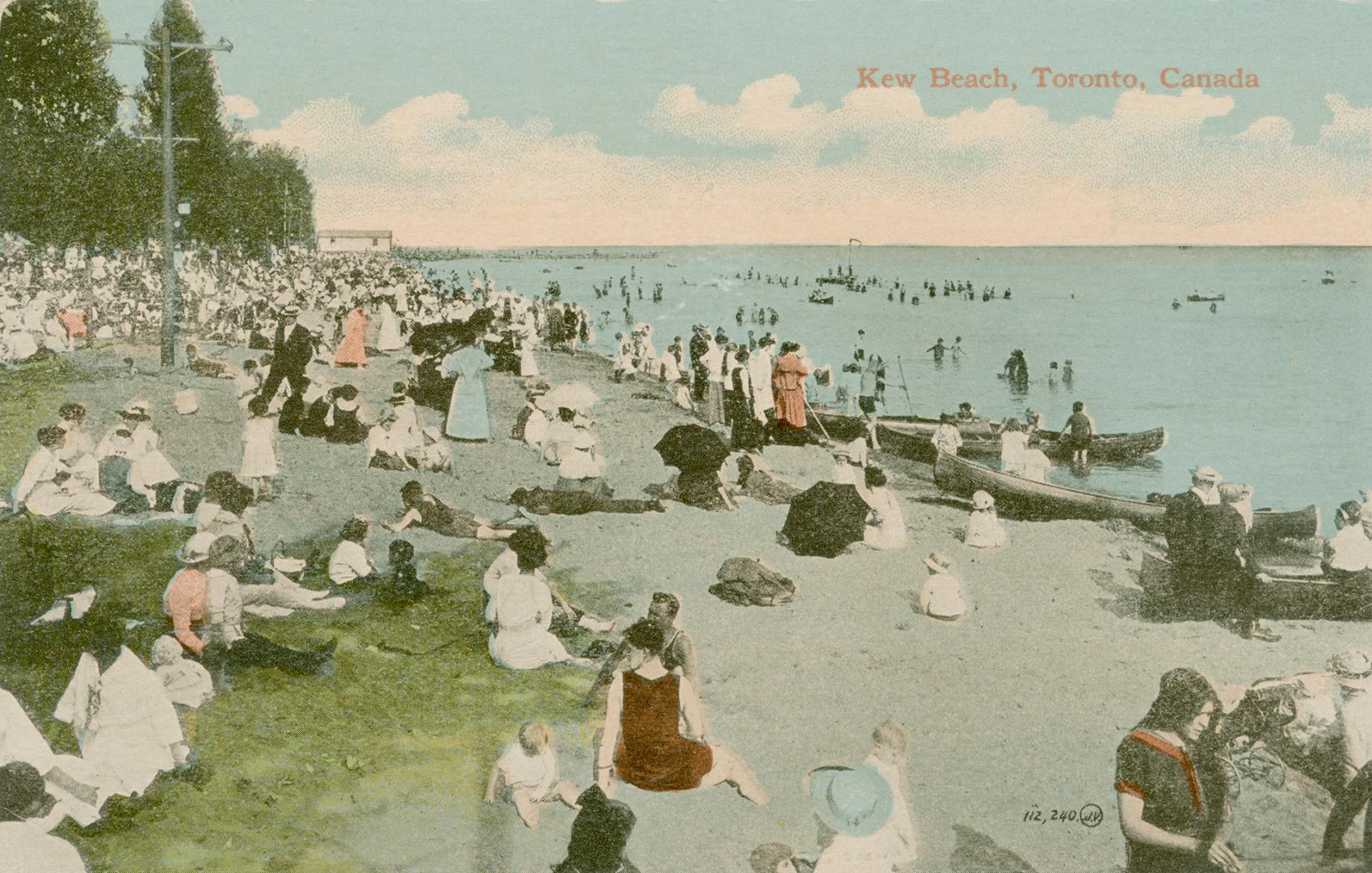 Picture of a crowded beach beside a body of water.