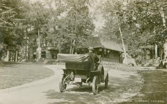 Black and white pictures of a man driving a car through a park.