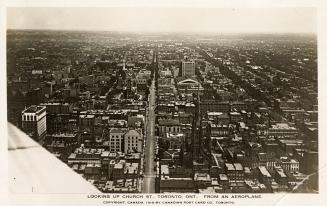 Aerial shot of a large city. Black and white.