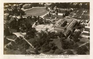 Aerial shot of a large city with large buildings. Black and white.