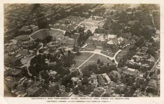 Aerial shot of a large city with tall buildings. Black and white.