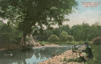 Colorized photograph of an artist sitting on a stool by a river painting the scene on a canvass…