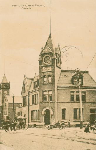 Sepia toned photograph a a three story public building with a tower on it's corner.