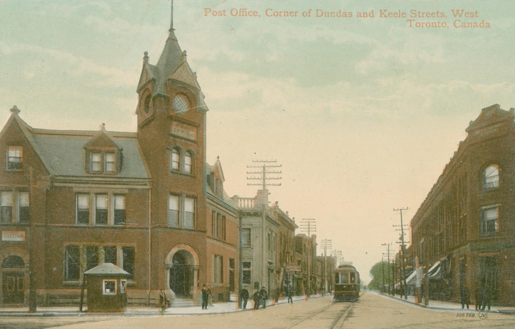 Colorized photograph a a three story public building with a tower on it's corner on a busy city…