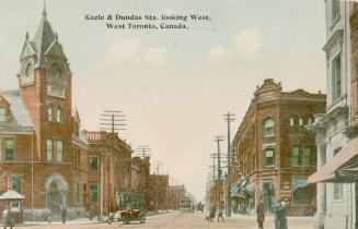 Colorized photograph a busy city street with three story buildings on either side.