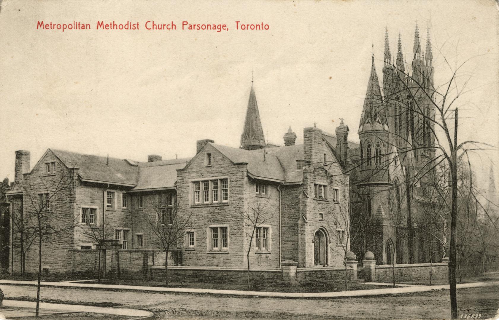 view of stone parsonage building. 