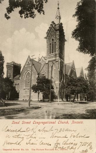 Picture of large church building with steeple surrounded by trees. 