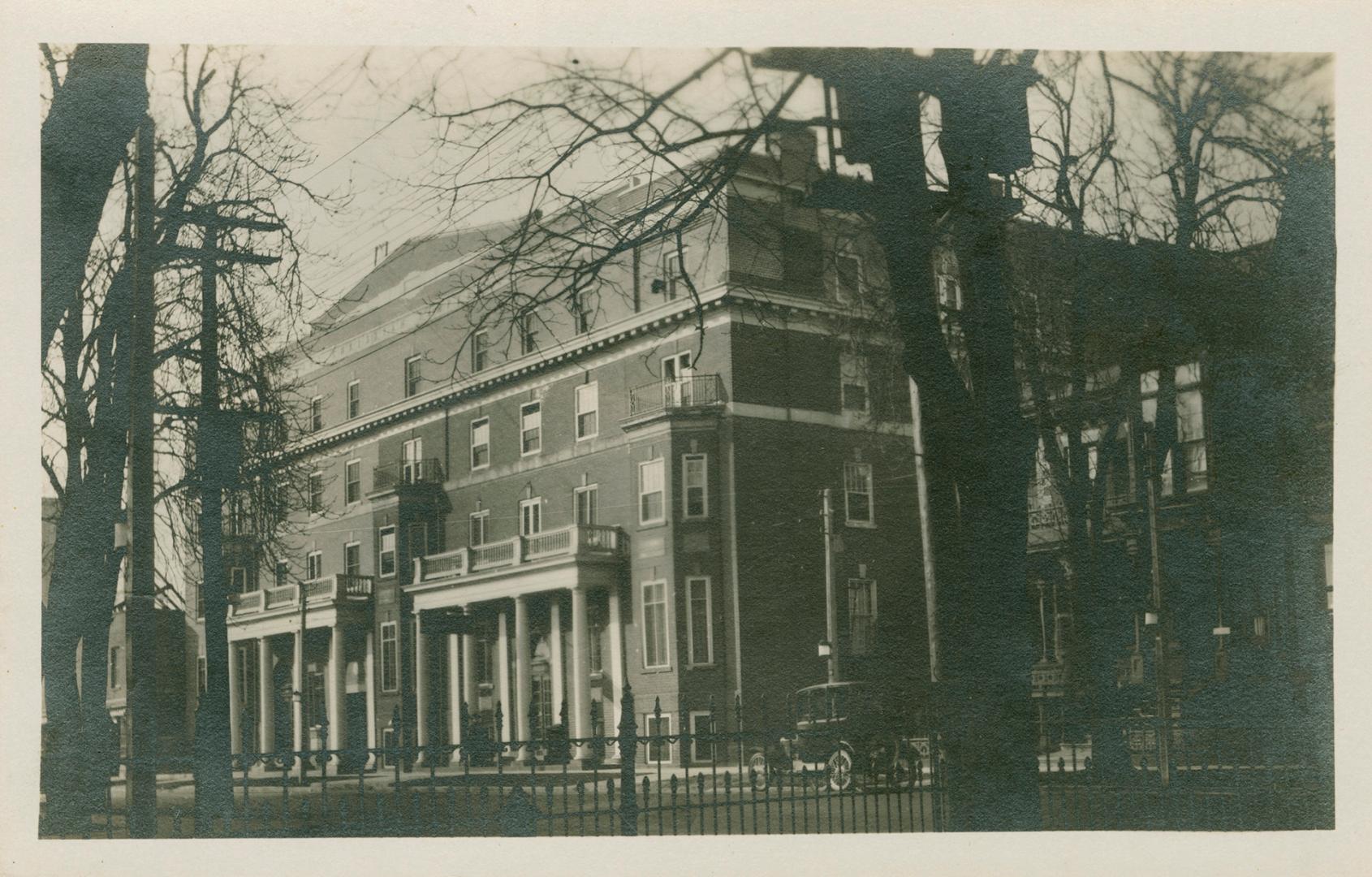 Black and white photograph of very large public building with columns in front at two front doo…