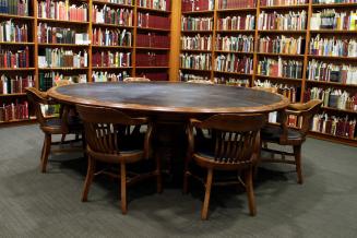 A large, round wooden table.