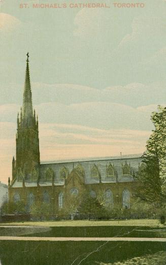 Picture of large cathedral church surrounded by trees. 