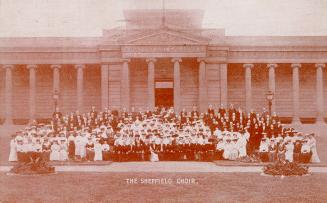 Picture of large choir in front of art gallery. 