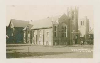 Picture of large church building with square tower. 