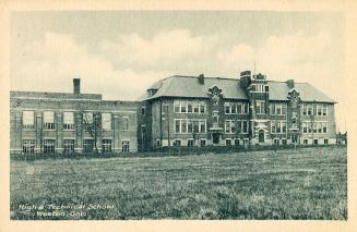 Black and white photograph of a three story collegiate building.