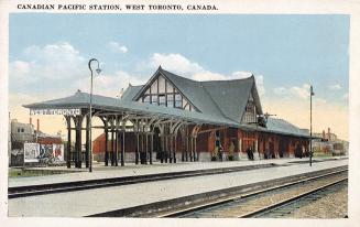 Picture of railway station with tracks in foreground. 