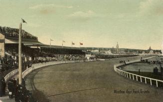 Picture of a racetrack and large grandstand. 