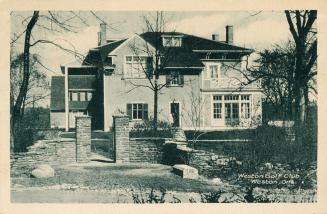 Black and white picture of a large house.