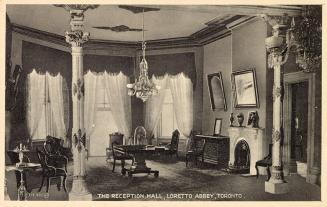 Black and white photograph of a large formal drawing room.