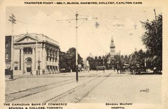 Black and white picture of a city street scene with a gothic style building at the end of it.