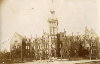 Black and white picture of a gothic school building with a central tower